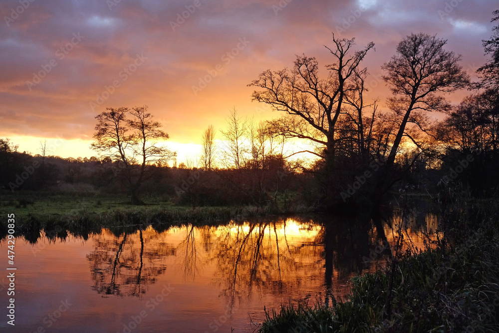 Winter sunset over the River Wey in Godalming, Surrey, UK Winter sunset over the River Wey in Godalming, Surrey, UK
