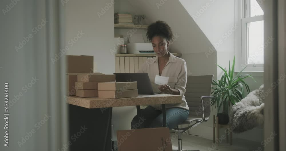 Afro American Woman Preparing Parcel Boxes for Shipment at Home, Entrepreneur Afro American Woman Preparing Parcel Boxes for Shipment at Home, Entrepreneur