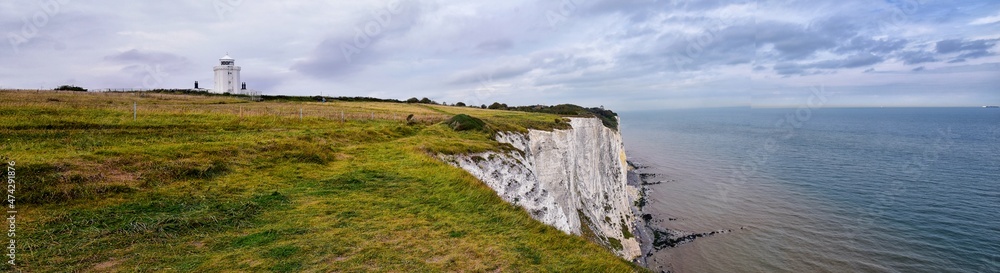 White Cliffs of Dover. Close up detailed landscape view of the cliffs from the walking path by the sea side. September 14, 2021 in England, United Kingdom, UK. White Cliffs of Dover. Close up detailed landscape view of the cliffs from the walking path by the sea side. September 14, 2021 in England, United Kingdom, UK.