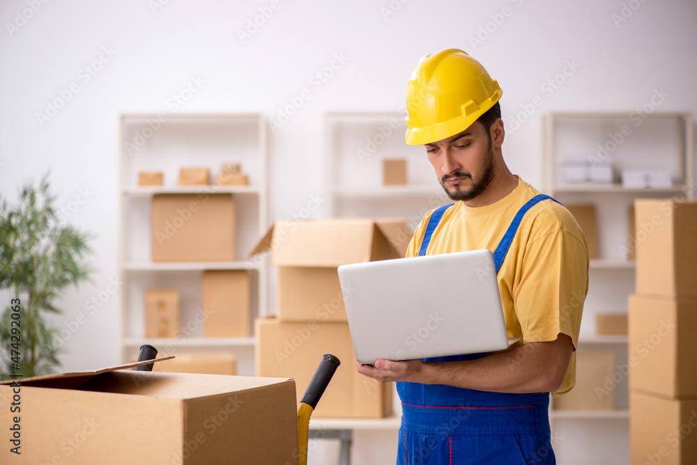 Young male contractor doing home relocation Young male contractor doing home relocation