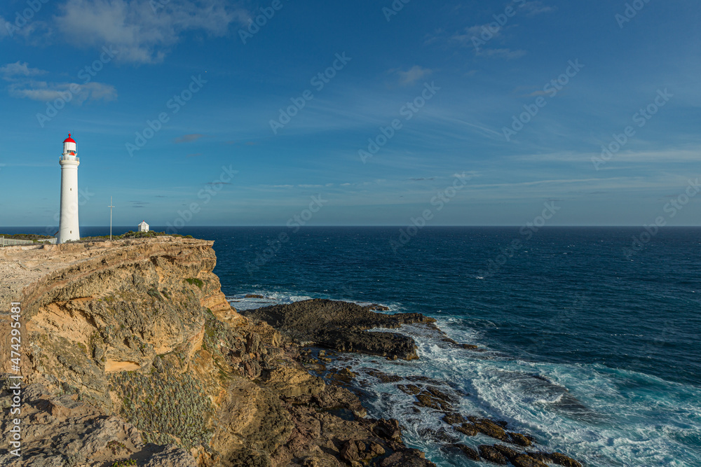 Cape Nelson Lighthouse and coastline on the southern ocean in Victoria, Australia