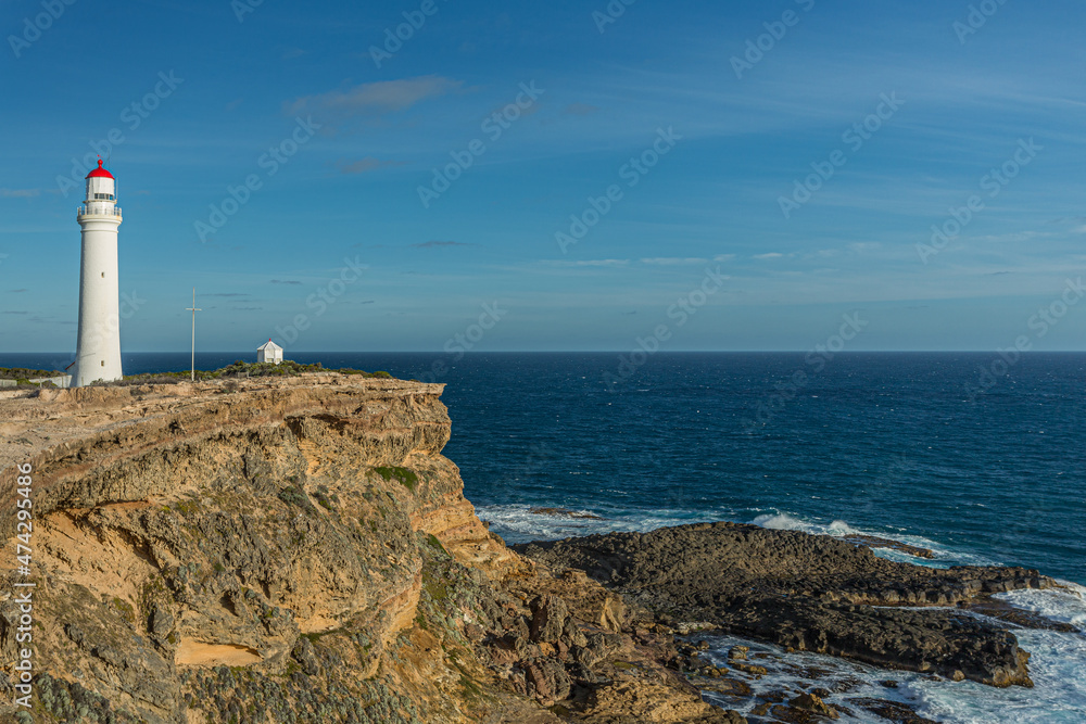 Cape Nelson Lighthouse and coastline on the southern ocean in Victoria, Australia