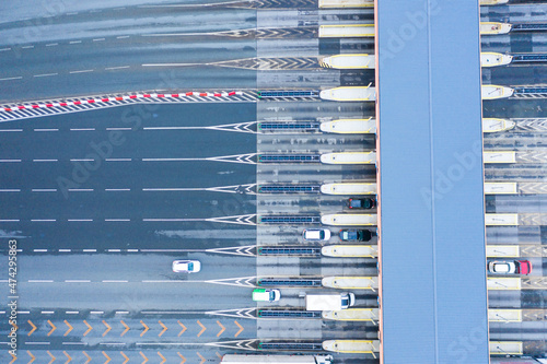 Aerial drone view on toll collection point on motorway at night.