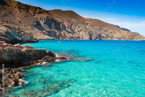 Turquoise clear water of Octopus bay and rocks, Crete, Greece