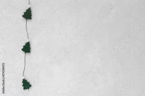 New Year trees garland on grey background, copy space