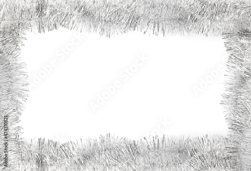 Frame made of shiny silver tinsels on white background, top view. Space for text