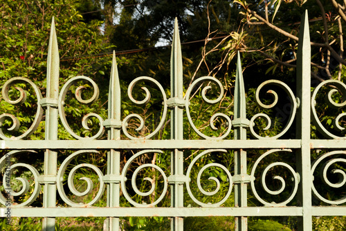 Bilde på lerret Wrought iron fence boundary of private property exposed to the elements, antique details