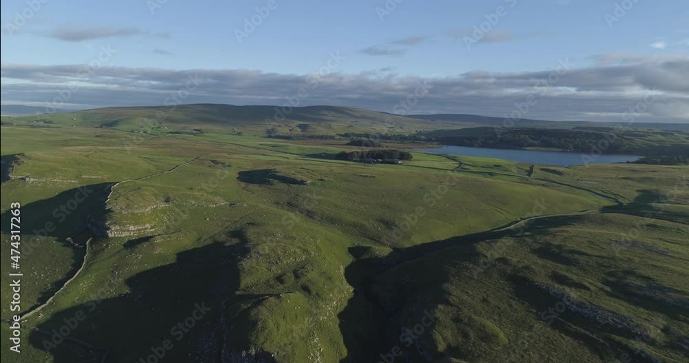 Aerial shot of a green moorland and a gorge in north England. Aerial shot of a green moorland and a gorge in north England.