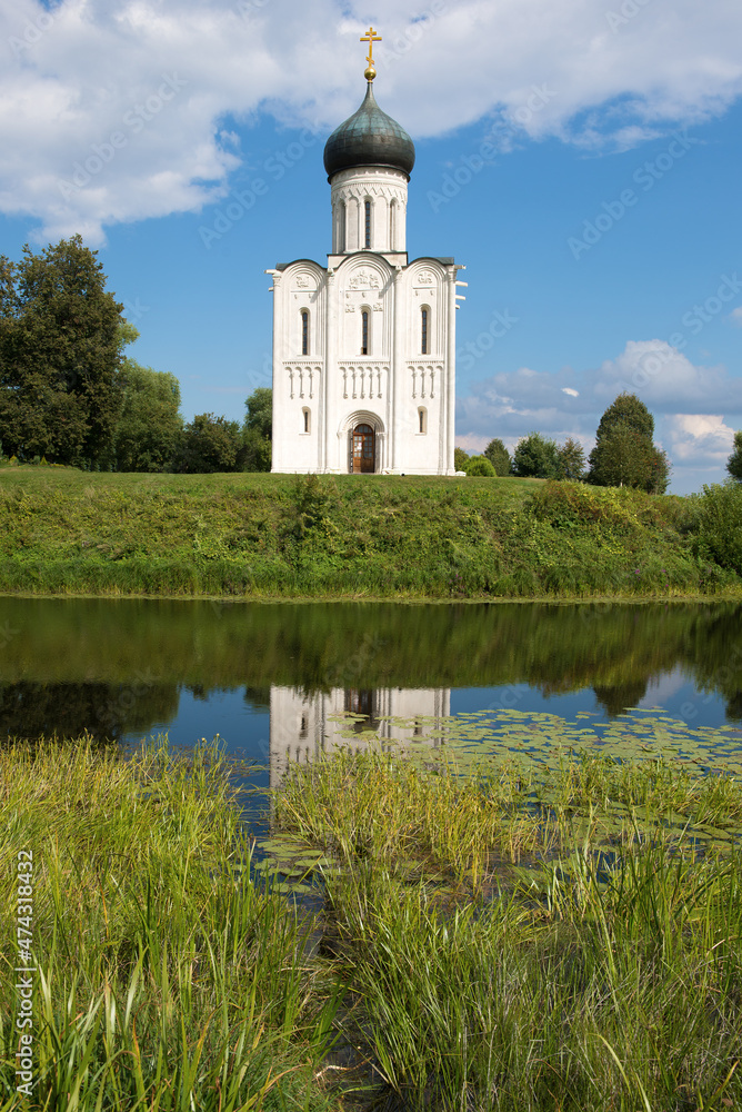 At the ancient Church of the Intercession on the Nerl on a sunny August day. Bogolyubovo, Russia At the ancient Church of the Intercession on the Nerl on a sunny August day. Bogolyubovo, Russia