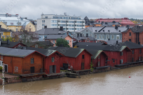 Old wooden barns are the symbol of Porvoo in the cityscape on a gloomy October day. Finland