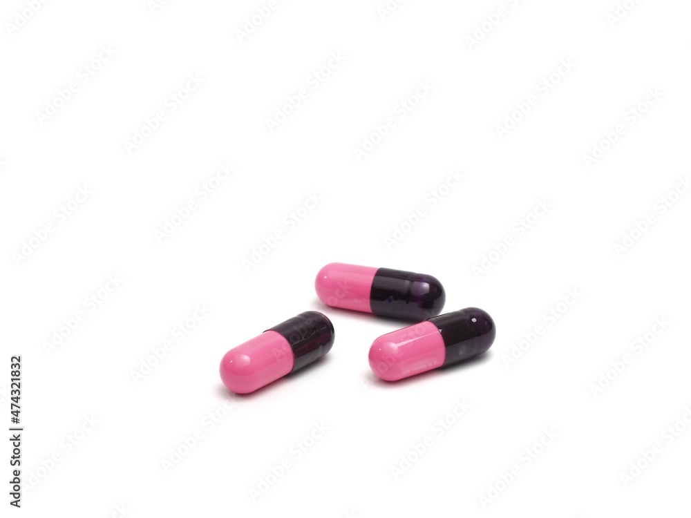 photograph of capsule pills on a white background photograph of capsule pills on a white background