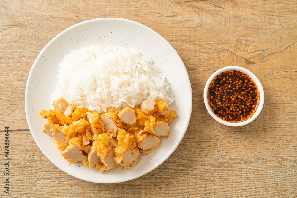 fried chicken topped rice with dipping sauce fried chicken topped rice with dipping sauce