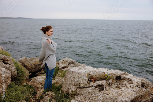 woman beach tourism cloudy weather stone coast Lifestyle © SHOTPRIME STUDIO