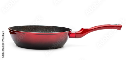 Red frying pan with non-stick coating on white.