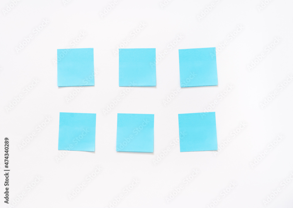 six  blue stickers on a white background