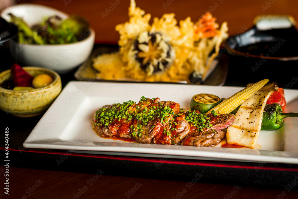 Dry aged ribeye SERVED WITH MISO SOUP, SALAD, TEMPURA, NOBU BISCUITS & GREEN TEA Dry aged ribeye SERVED WITH MISO SOUP, SALAD, TEMPURA, NOBU BISCUITS & GREEN TEA