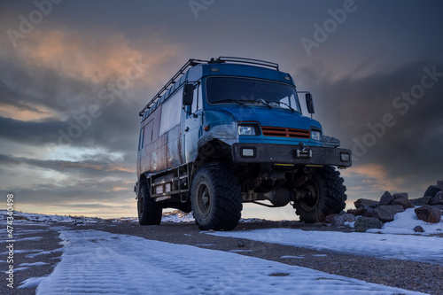 Fotografie, Obraz Off-road truck for transporting people in the north of Russia at sunset
