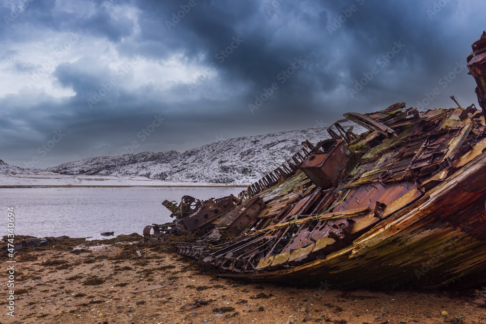 An old broken fishing boat. Teriberka village, Murmansk region, Russia.