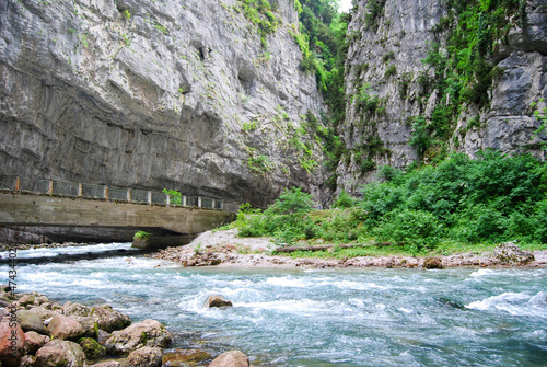 River in Yupsharsky canyon. Yupsharsky Canyon, the road to Lake Ritsa. Rocks, mountain river, bridge. Abkhazia photo