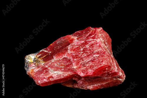 macro mineral Rhodonite stone on a black background