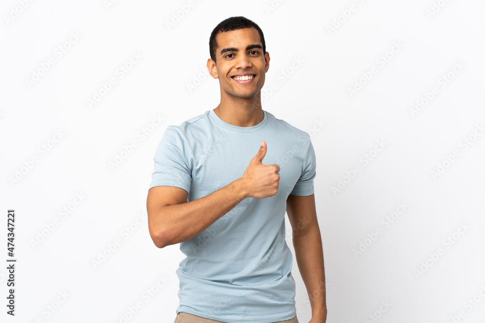 Fototapeta premium African American man over isolated white background giving a thumbs up gesture
