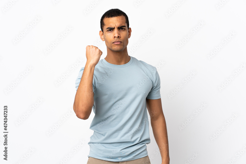 African American man over isolated white background with unhappy expression African American man over isolated white background with unhappy expression