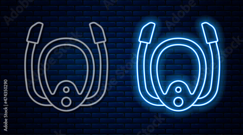 Glowing neon line Diving mask with snorkel icon isolated on brick wall background. Extreme sport. Diving underwater equipment. Vector