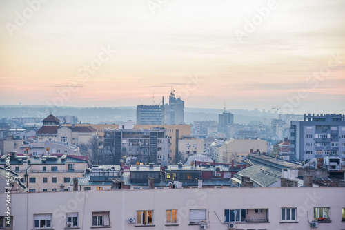 Belgrade autumn cityscape view with the grey sky above the city during the dusk at the end of the fall and start of the winter time casting the perfect sunset light for the capital city of Serbia