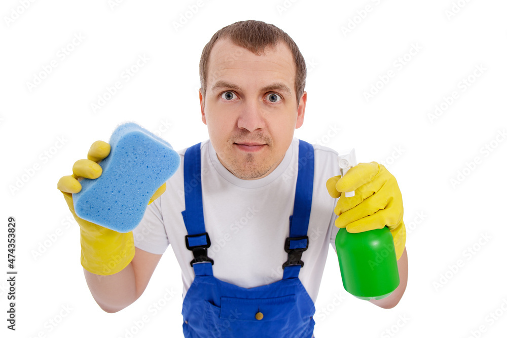 funny male cleaner in blue uniform cleaning window or something other with wipe and detergent spray isolated on white background funny male cleaner in blue uniform cleaning window or something other with wipe and detergent spray isolated on white background