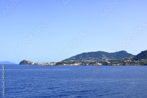 view to Ischia Ponte village and the coastline from the boat photo