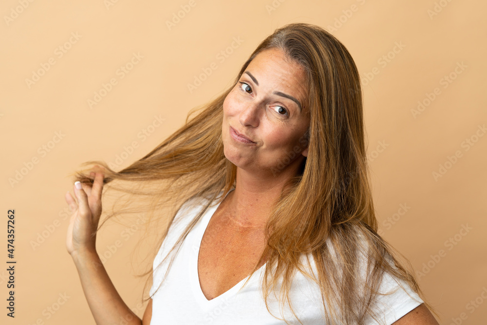 Middle age brazilian woman isolated on beige background . Portrait Middle age brazilian woman isolated on beige background . Portrait