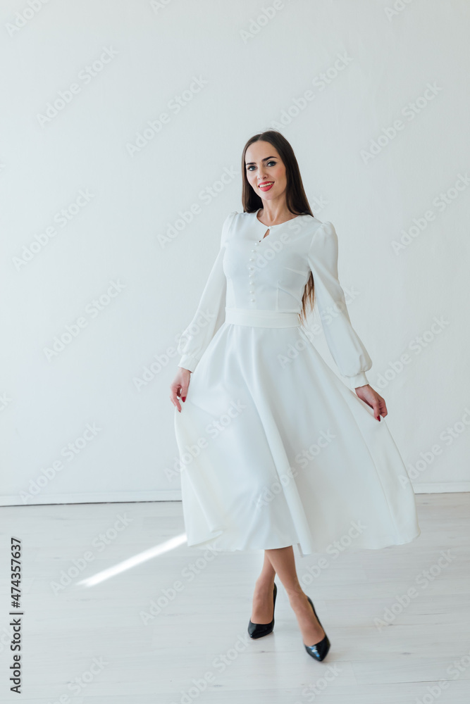 beautiful woman in a light summer dress on a white background beautiful woman in a light summer dress on a white background