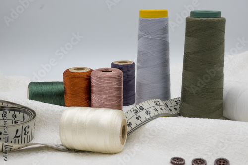 Stitching Material, Measurement Type, Thread Coan, Buttons.   photo