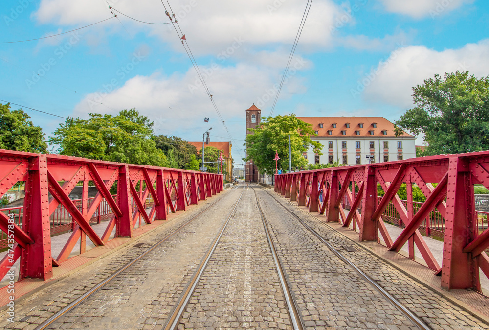 Wroclaw, Poland - crossed by the Oder River, Wroclaw displays a large number of colorful bridges, which are a main landmark of the town. Here in particular a typical iron bridge Wroclaw, Poland - crossed by the Oder River, Wroclaw displays a large number of colorful bridges, which are a main landmark of the town. Here in particular a typical iron bridge