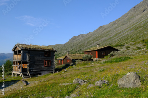 Traditional wooden turf houses in the Norwegian mountains. Spiterstulen - Norwegian tourist hostel located in Jotunheimen Mountains, in Visdalen valley, on Visa River. Jotunheimen National Park