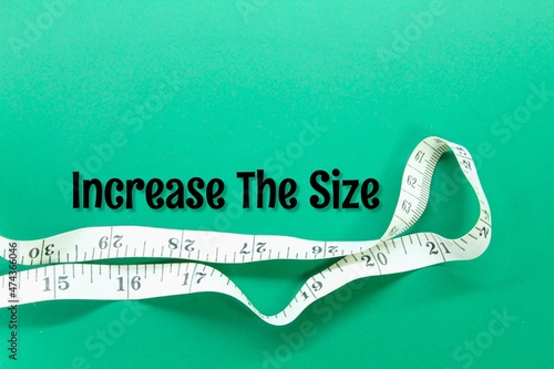 measuring tape with the words increase the size photo