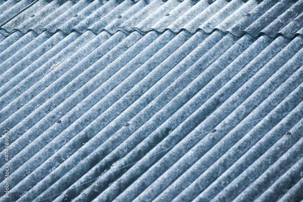 The abestos roof of Indonesian house that looks like a diagonally textured background. The abestos roof of Indonesian house that looks like a diagonally textured background.