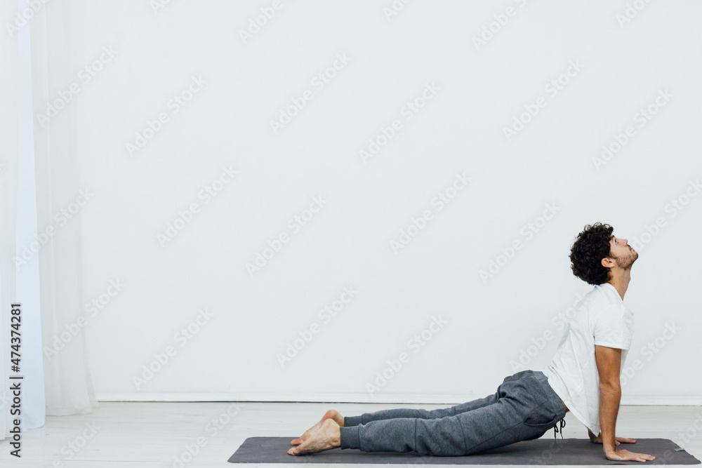 man doing exercises yoga asana fitness gymnastics man doing exercises yoga asana fitness gymnastics