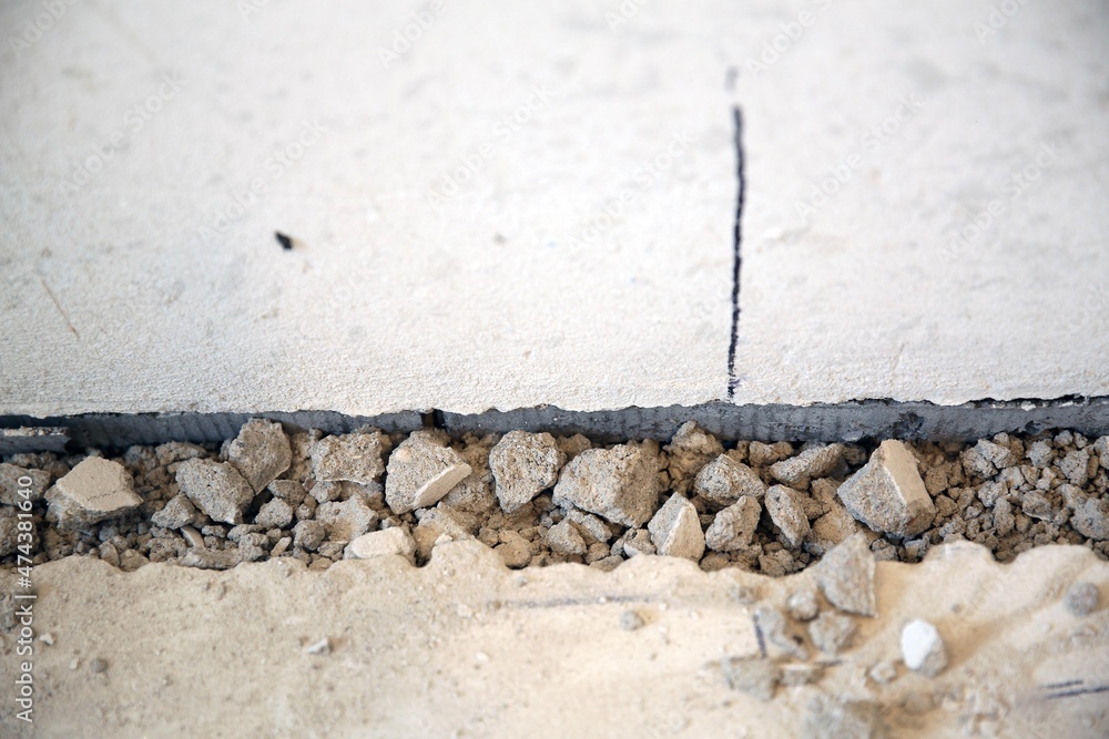 Stones on the floor, broken floor, devastation, screed, flooring repair