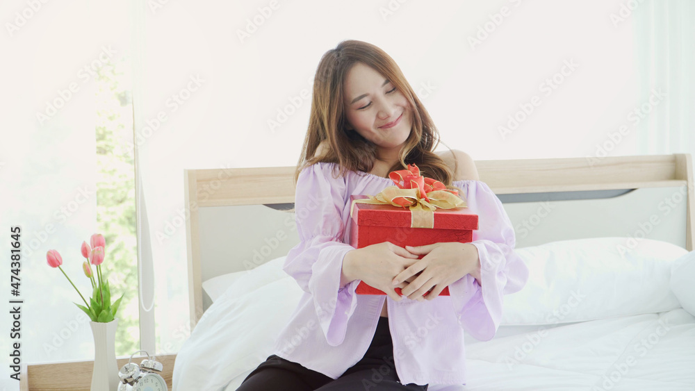 Happy smile young woman hug red gift box birthday Happy smile young woman hug red gift box birthday