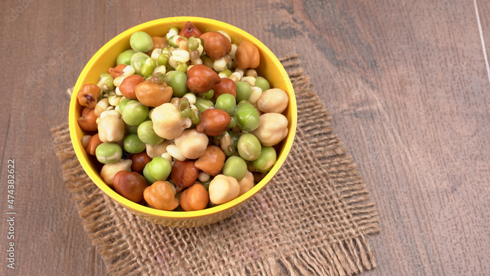Healthy diet and vegetarian food. Mix of fresh sprouts on beautiful background. macrobiotic food. Sprouted wheat, peas, lentil seeds. Copy space Healthy diet and vegetarian food. Mix of fresh sprouts on beautiful background. macrobiotic food. Sprouted wheat, peas, lentil seeds. Copy space
