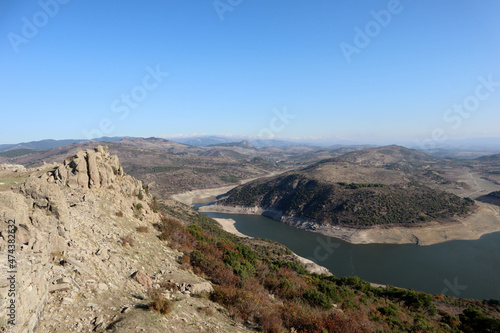 view to Kestel dam lake reservoir in the mountains from Pergamon acropolis, Turkey