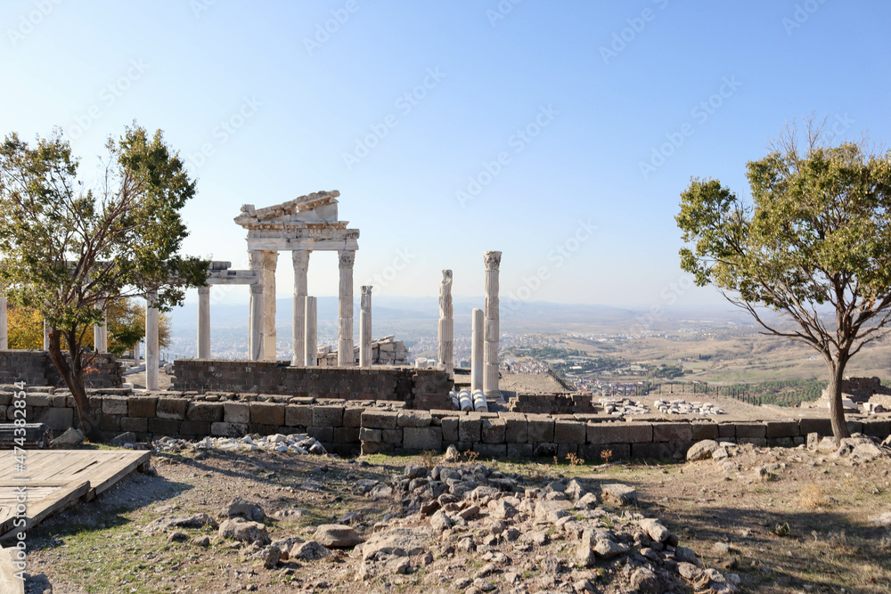 beautiful temple of Trajan autumn view with white marble columns with blue sky and valley background, ancient city Pergamon, Turkey