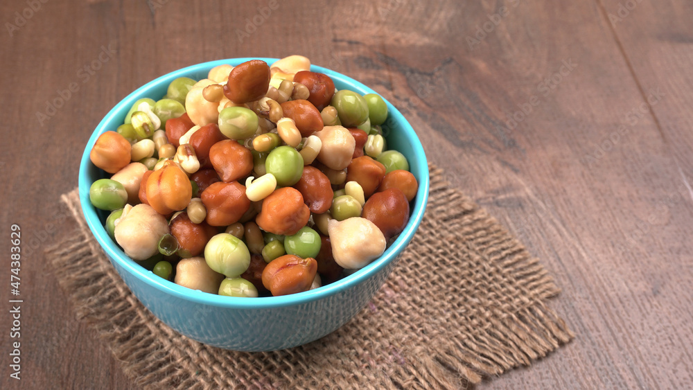 Healthy diet and vegetarian food. Mix of fresh sprouts on beautiful background. macrobiotic food. Sprouted wheat, peas, lentil seeds. Copy space Healthy diet and vegetarian food. Mix of fresh sprouts on beautiful background. macrobiotic food. Sprouted wheat, peas, lentil seeds. Copy space