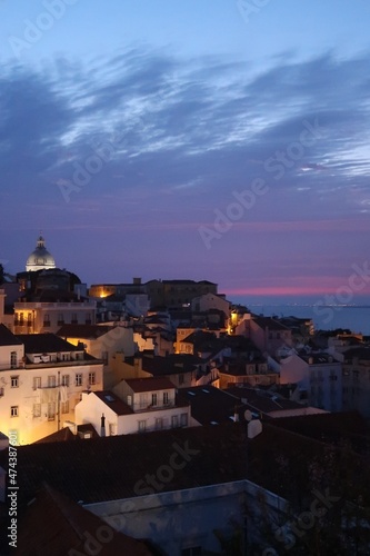 Cityscape Image of Lisbon, Portugal during dramatic sunrise.