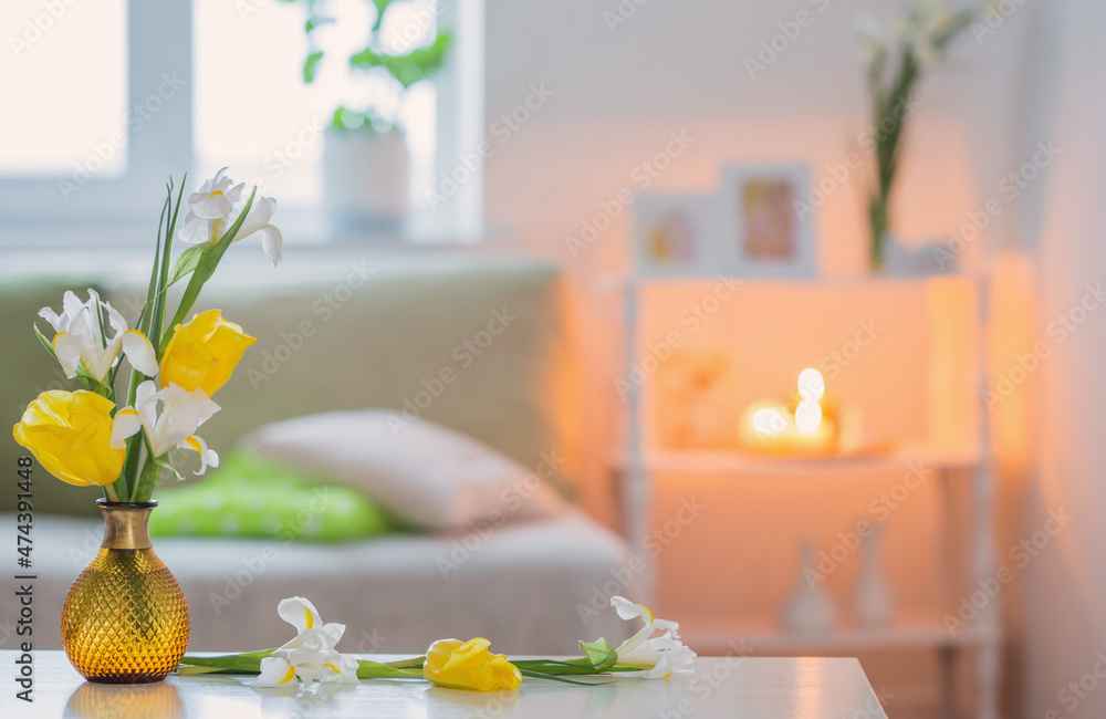 white home interior with spring flowers and decorations