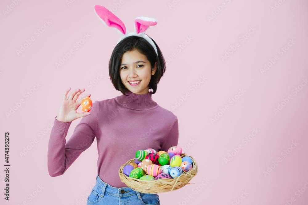 Portrait beautiful young asia girl with painted eggs, Happy easter day