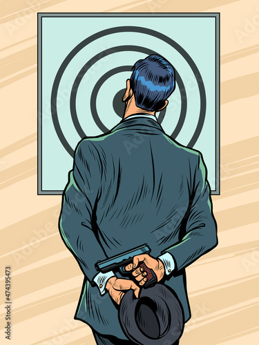 a man in a suit in a shooting gallery with a pistol, examines the target, the result of shooting