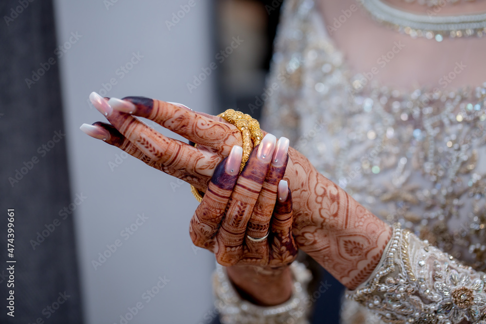 Hands of Newlywed Bride Wearing Ring and Bangles and Nice Henna Design closeup | Asian Bride Hands with Henna Design Closeup
