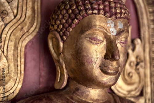 Wallpaper Mural The head and face and ear of the Buddha are made of red wood with gilding. Torontodigital.ca
